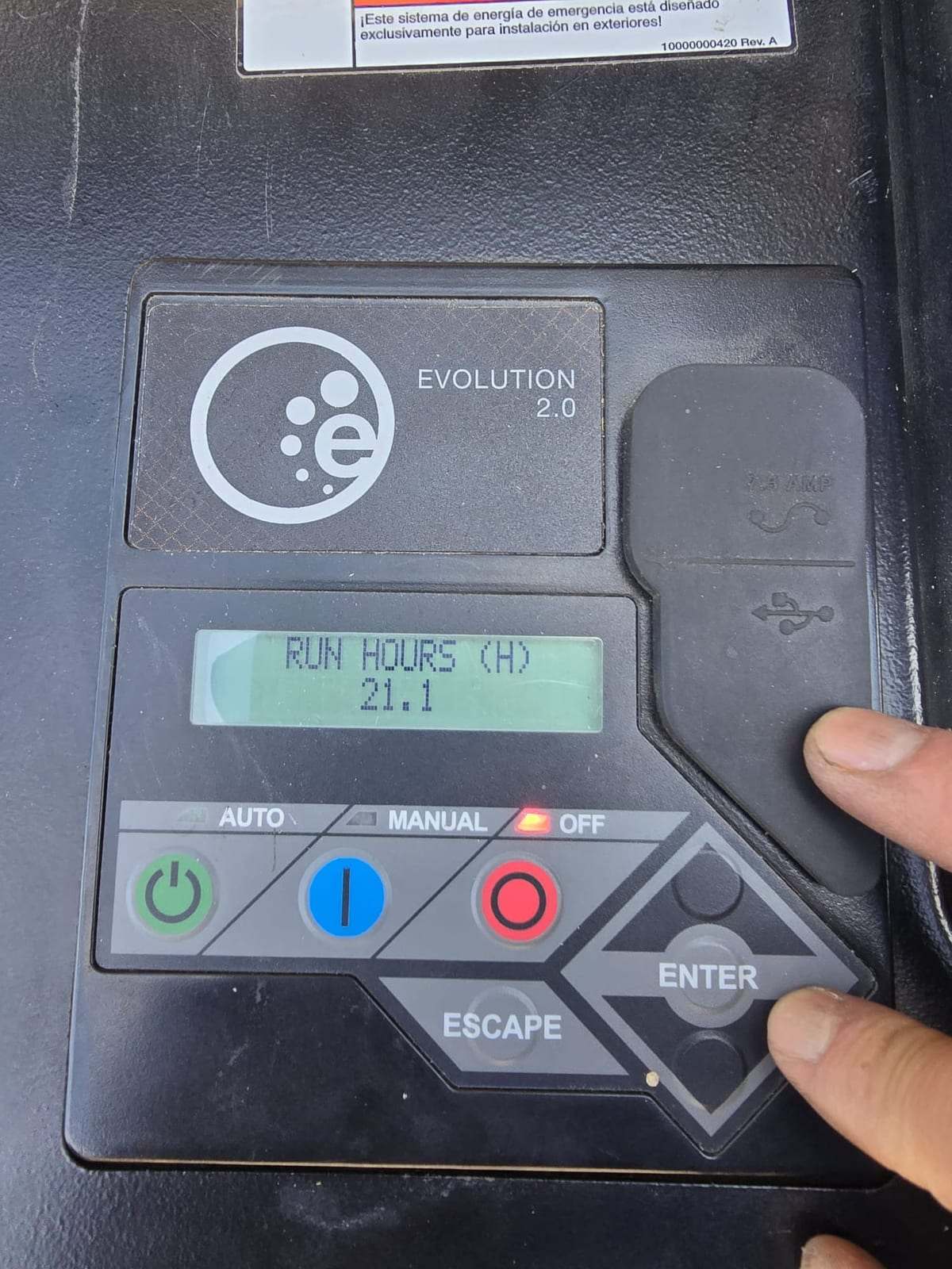 A Generac Evolution controller displaying accumulated run hours during a service visit